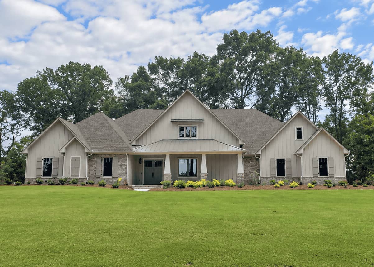 Craftsman home with several front gables, stone veneer, and square porch columns on stone piers. 4 beds, 3,618 sq ft - Plan #140-1148.