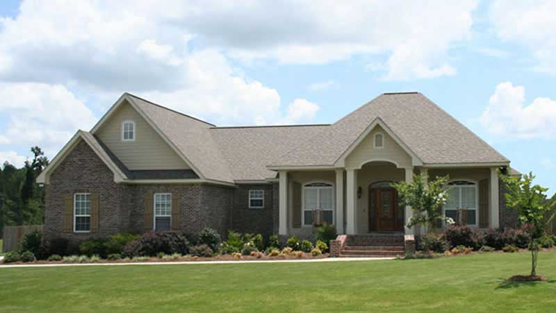 Front elevation of Acadian home (ThePlanCollection: House Plan #141-1071)