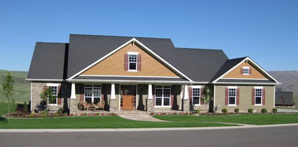 Front elevation photo of this Craftsman home (ThePlanCollection: House Plan #141-1290)