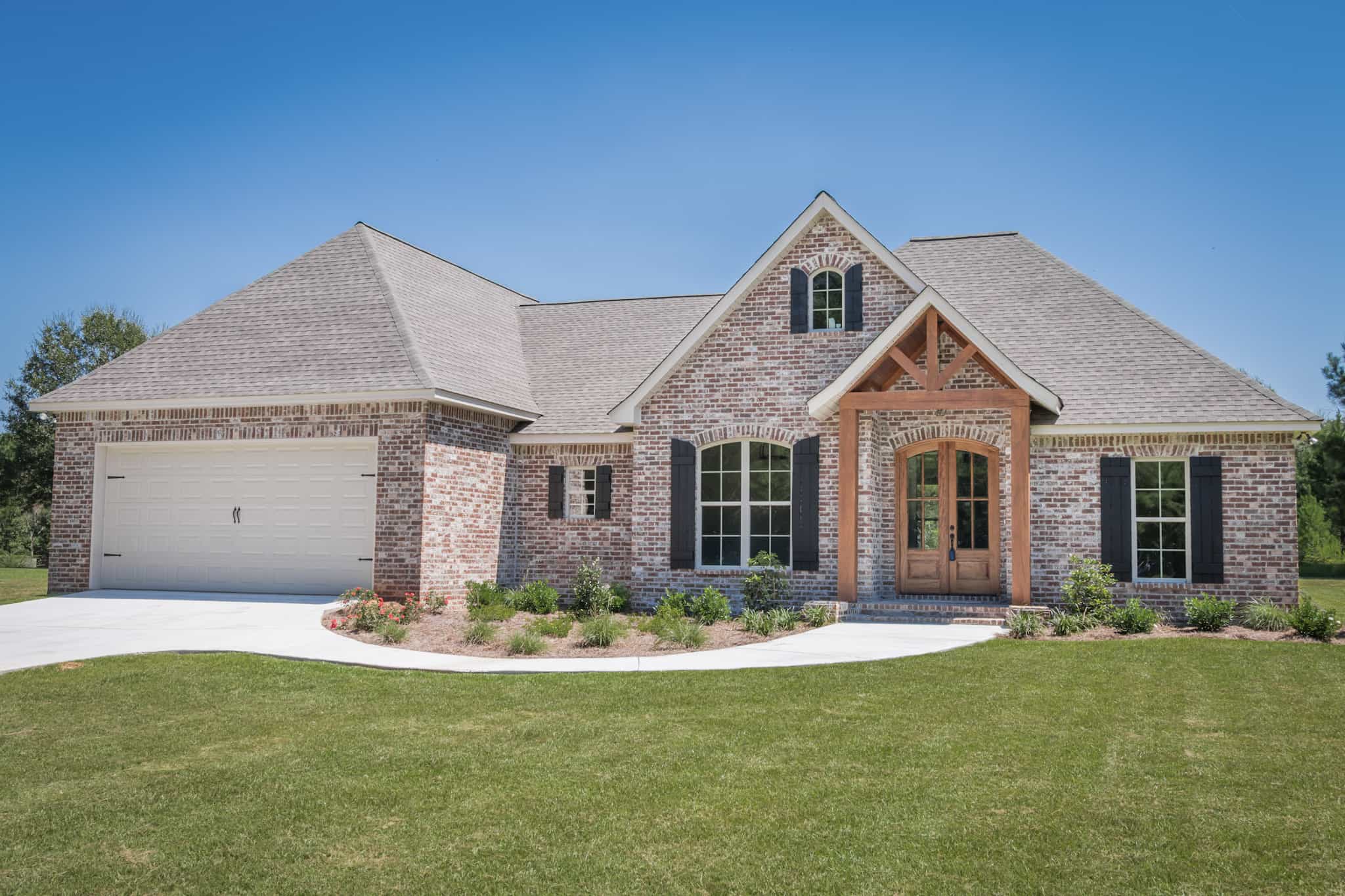 Front Elevation Photo of this Acadian House (#142-1083) at The Plan Collection.