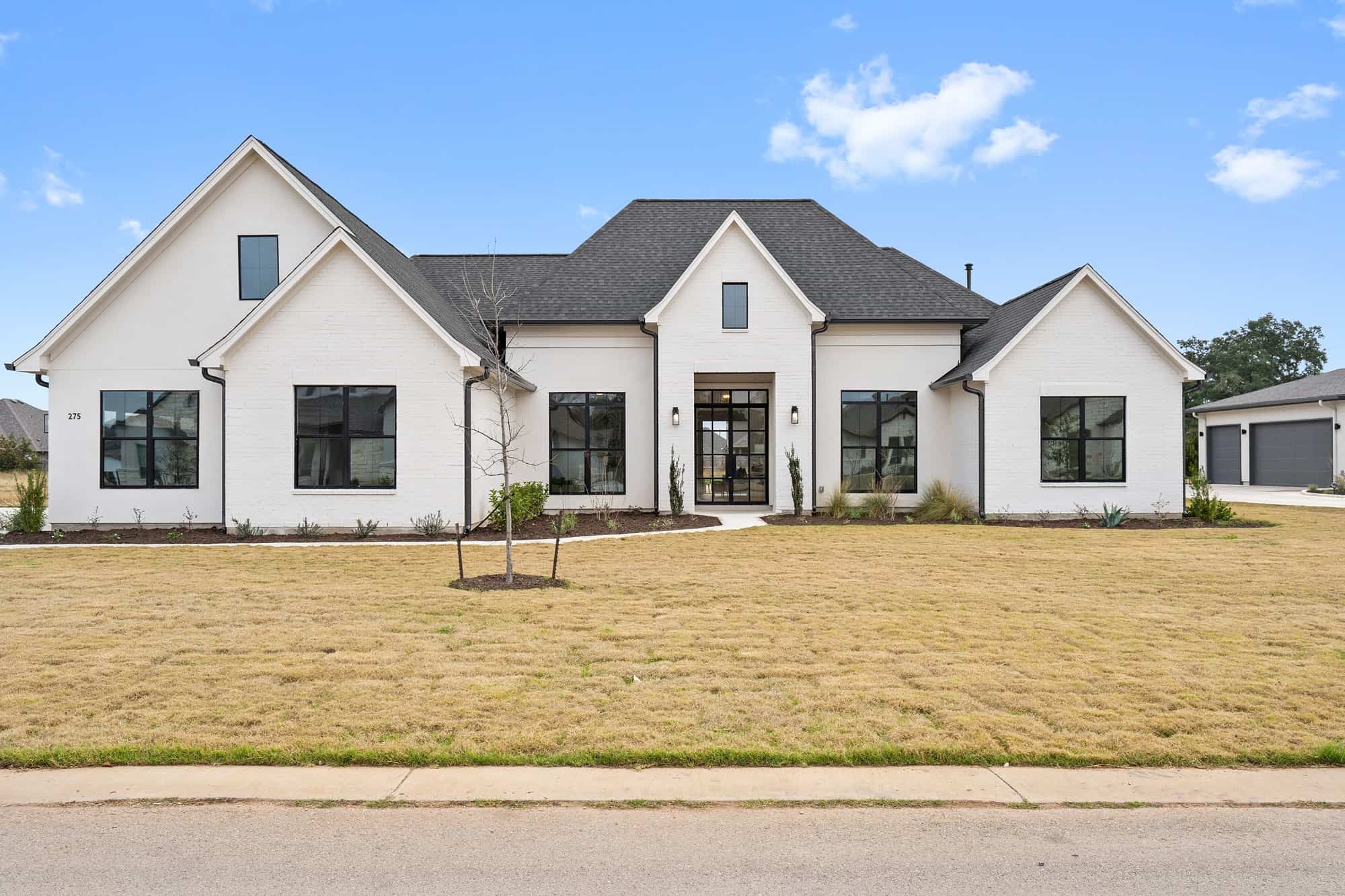 Front elevation of Contemporary home (ThePlanCollection: House Plan #142-1440)