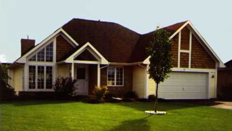 Front view of Country home (ThePlanCollection: House Plan #146-1041)