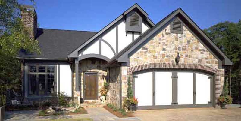 Front view of Tudor home (ThePlanCollection: House Plan #146-1662)