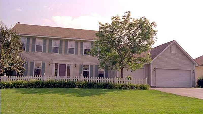 Front view of Colonial home (ThePlanCollection: House Plan #146-1908)