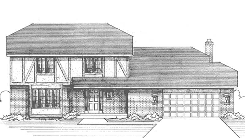 Front view of Tudor home (ThePlanCollection: House Plan #146-2623)