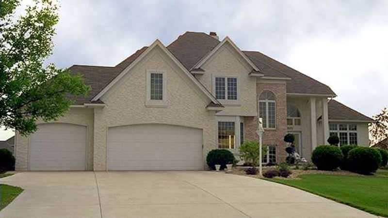 Front view of European home (ThePlanCollection: House Plan #146-2916)