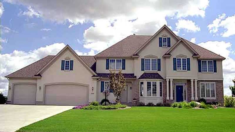 Front view of European home (ThePlanCollection: House Plan #146-2917)