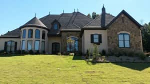 Front elevation of European home (ThePlanCollection: House Plan #153-2049)