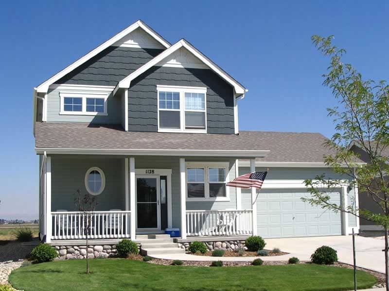 Front elevation of country home (ThePlanCollection: House Plan #161-1018)