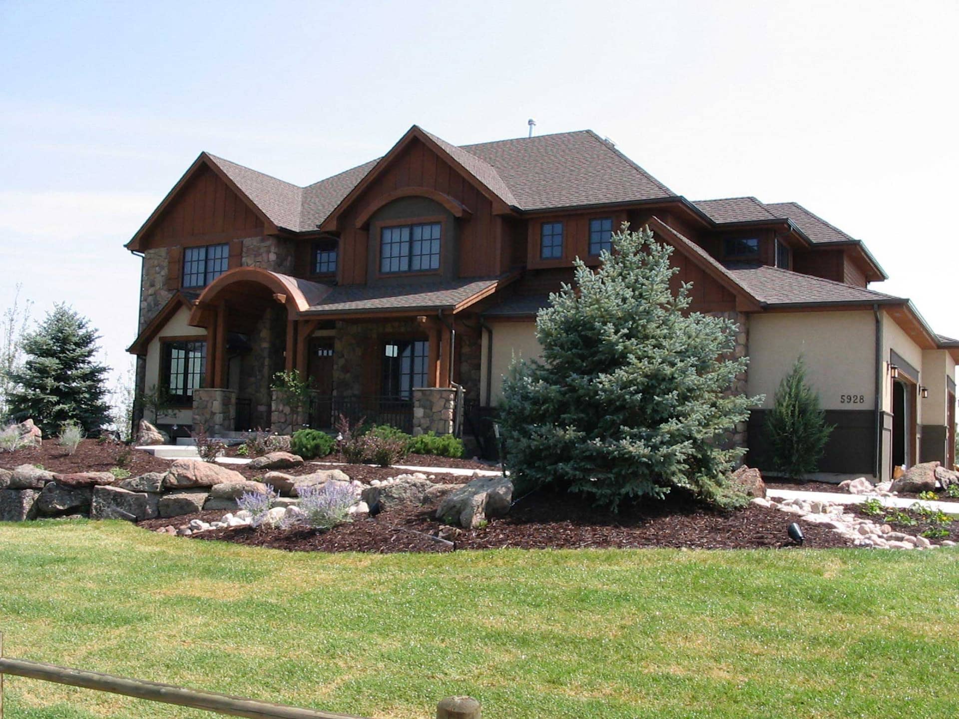 This is the front elevation photo for these Mountain House Plans.