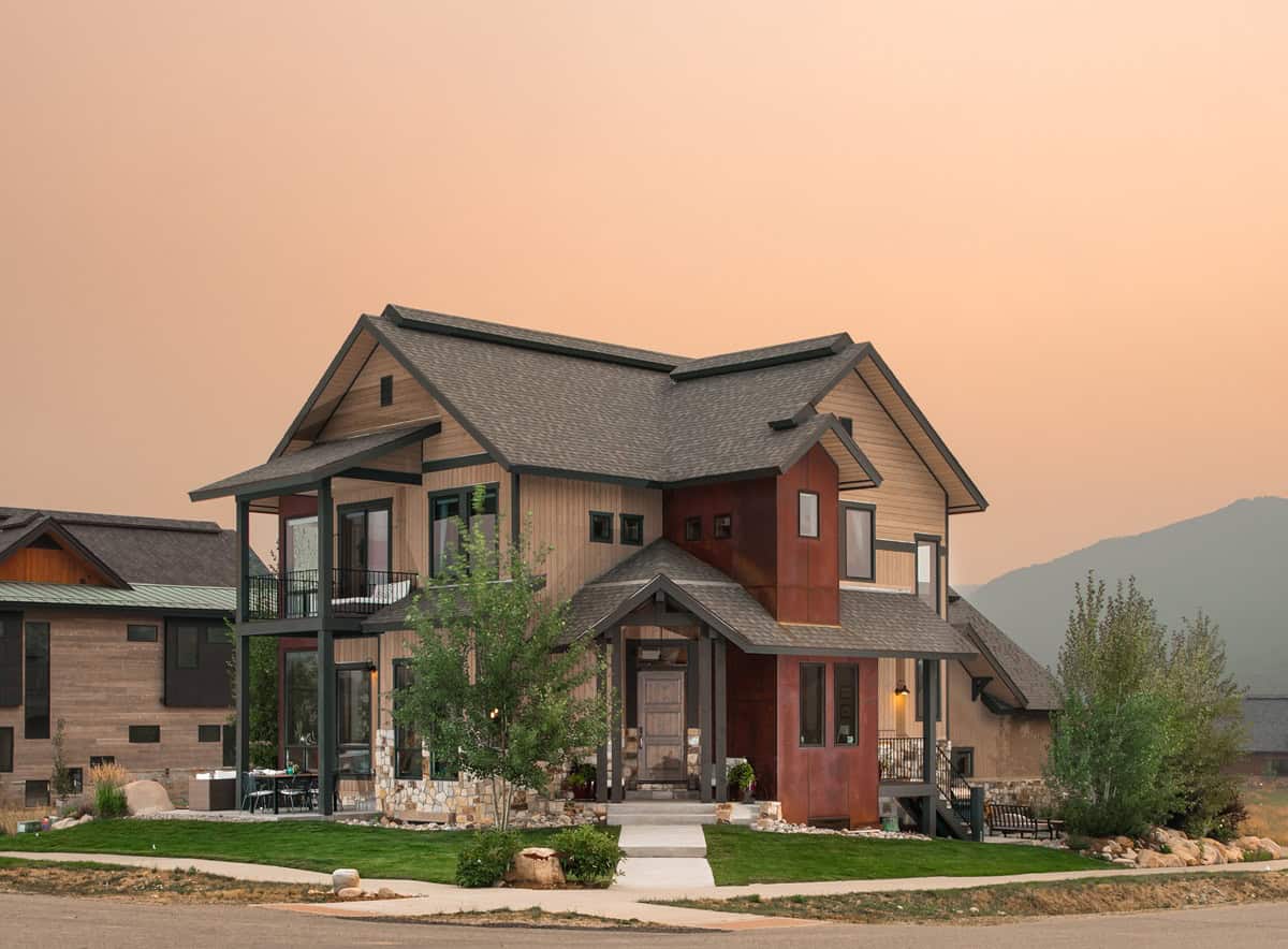 A two-story Craftsman home with covered front porch, stone accents, and wood siding details. 3 beds, 2,279 sq ft — Plan #161-1304.