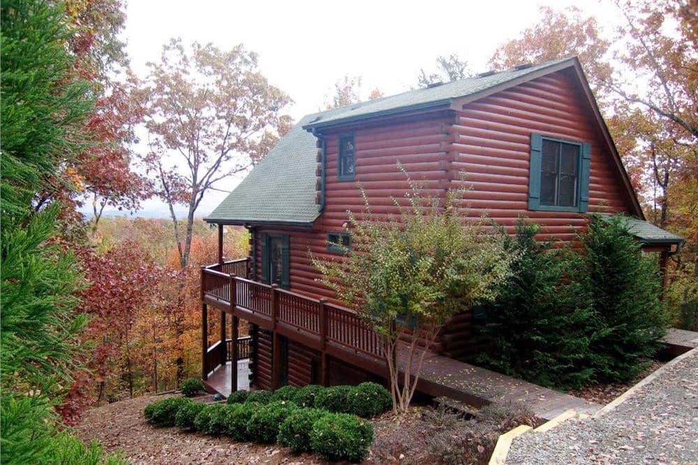 Color photograph of Log Cabin home plan (ThePlanCollection: House Plan #163-1000)