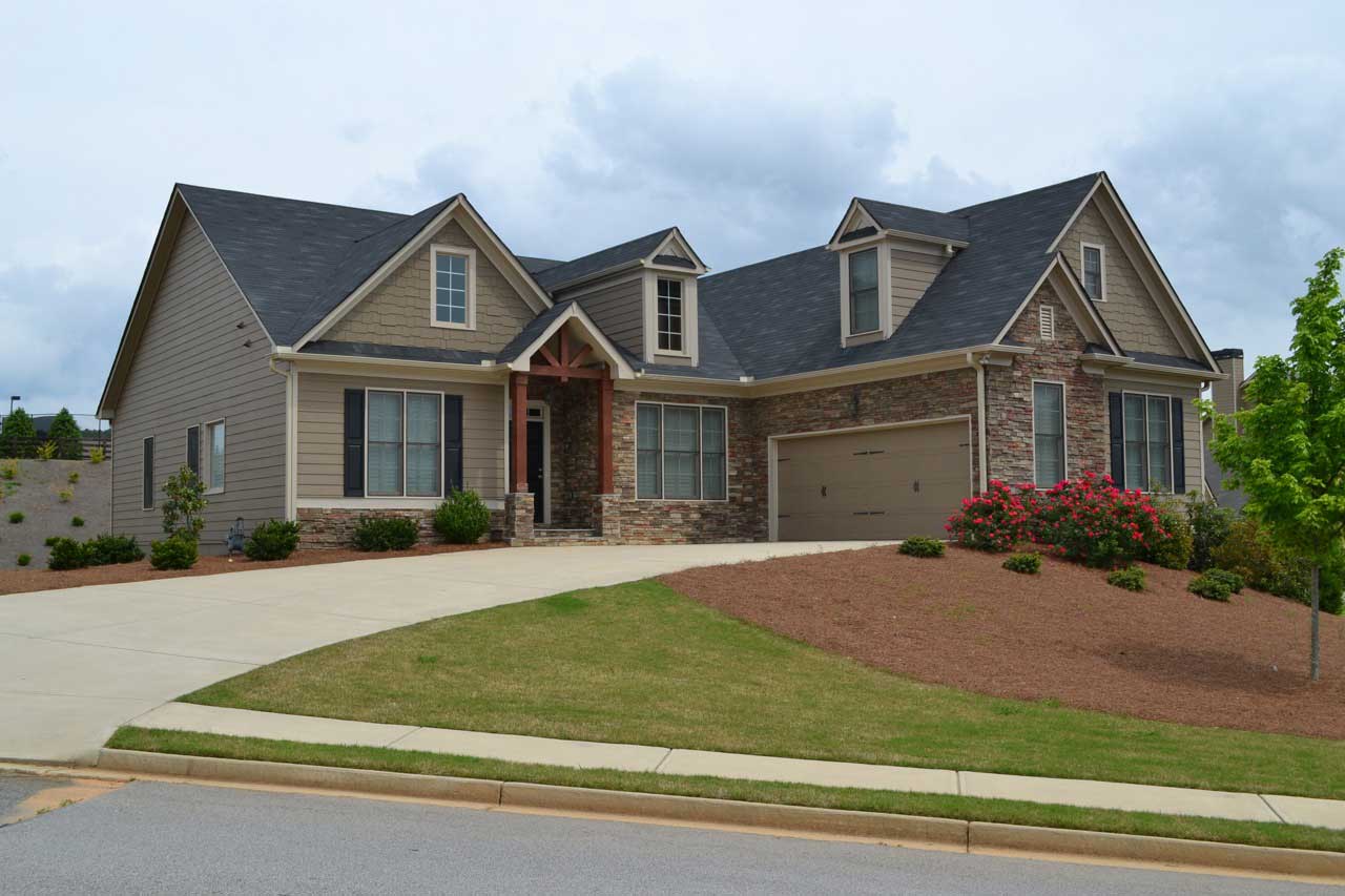 Front elevation of Ranch House Plan home (ThePlanCollection: House Plan #163-1049)