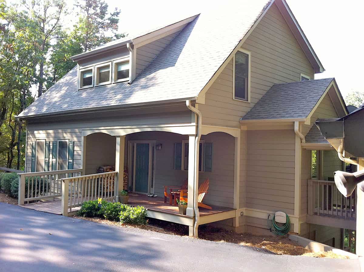 Front elevation of Farmhouse home (ThePlanCollection: House Plan #163-1088)