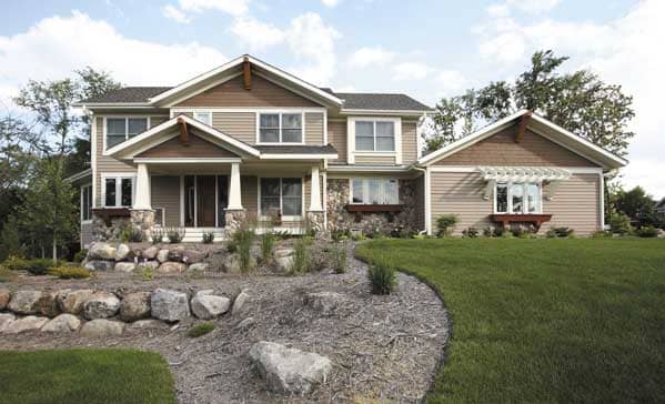 This Color Photo shows the front elevation of Craftsman Homeplans CLS-3308.