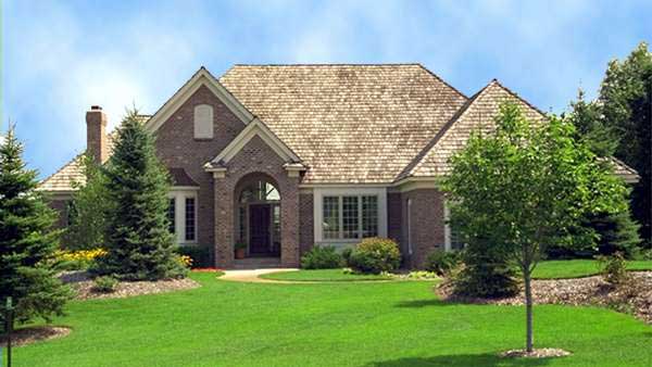 Front elevation of European home (ThePlanCollection: House Plan #165-1112)