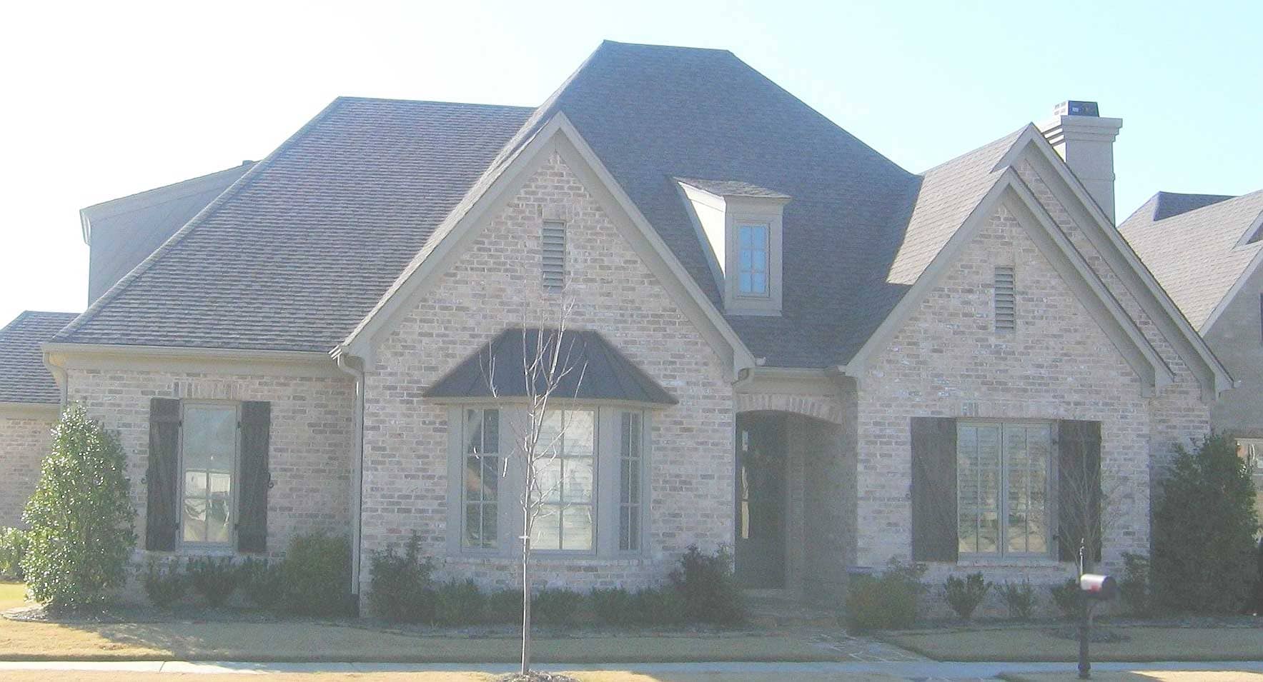 Front view of French home (ThePlanCollection: House Plan #170-1235)