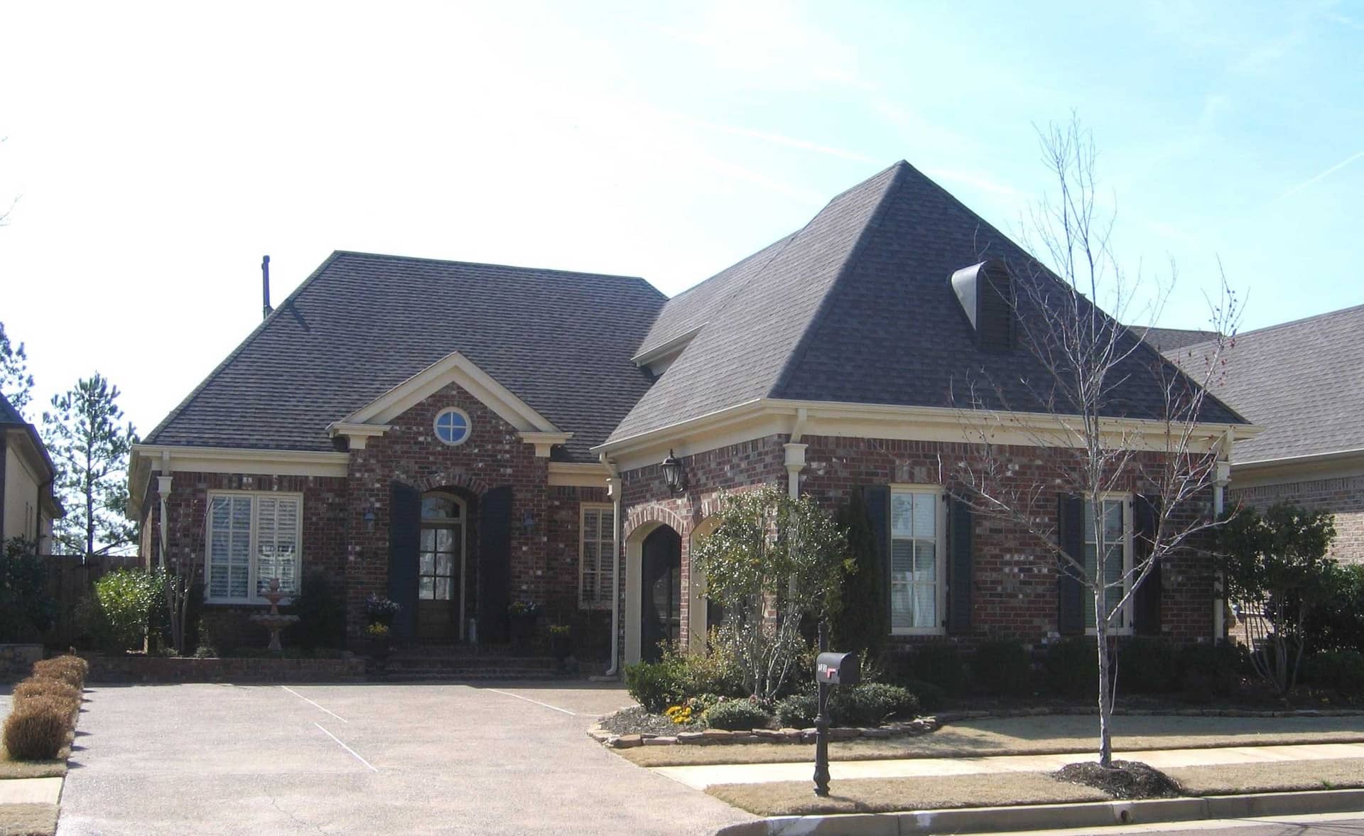 Front view of French home (ThePlanCollection: House Plan #170-1382)