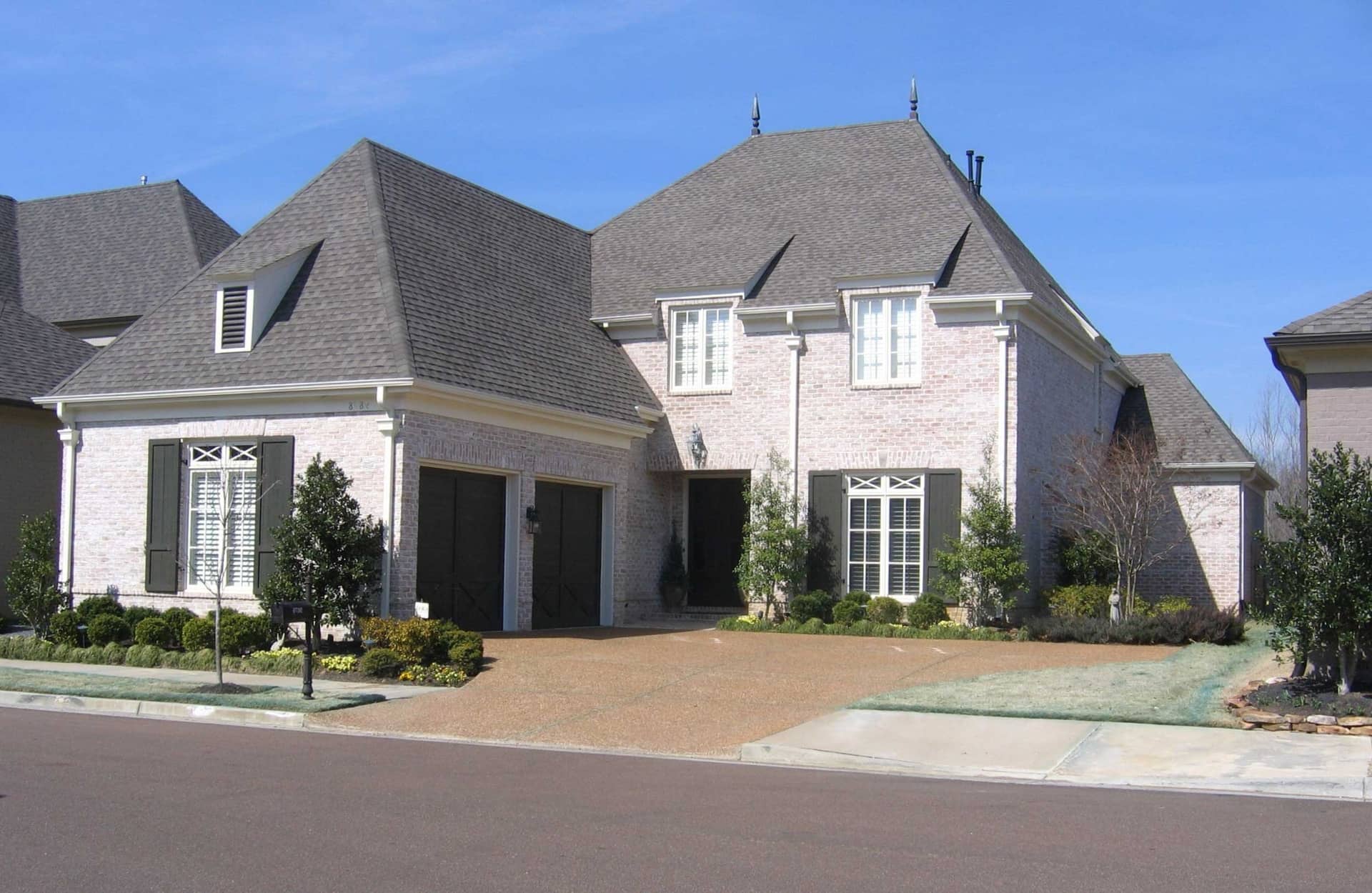 Front view of French home (ThePlanCollection: House Plan #170-1385)