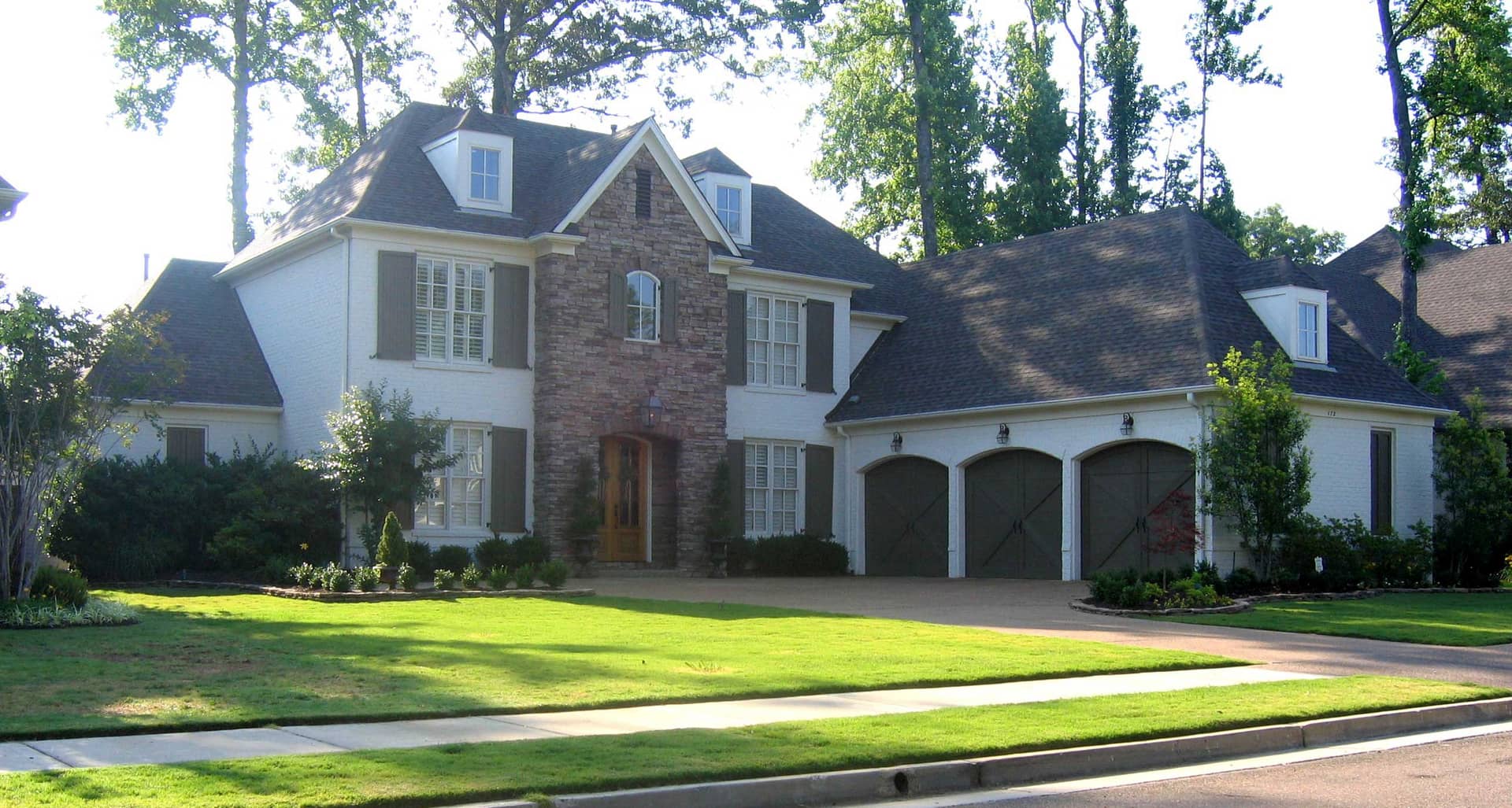 Front view of Luxury home (ThePlanCollection: House Plan #170-1403)