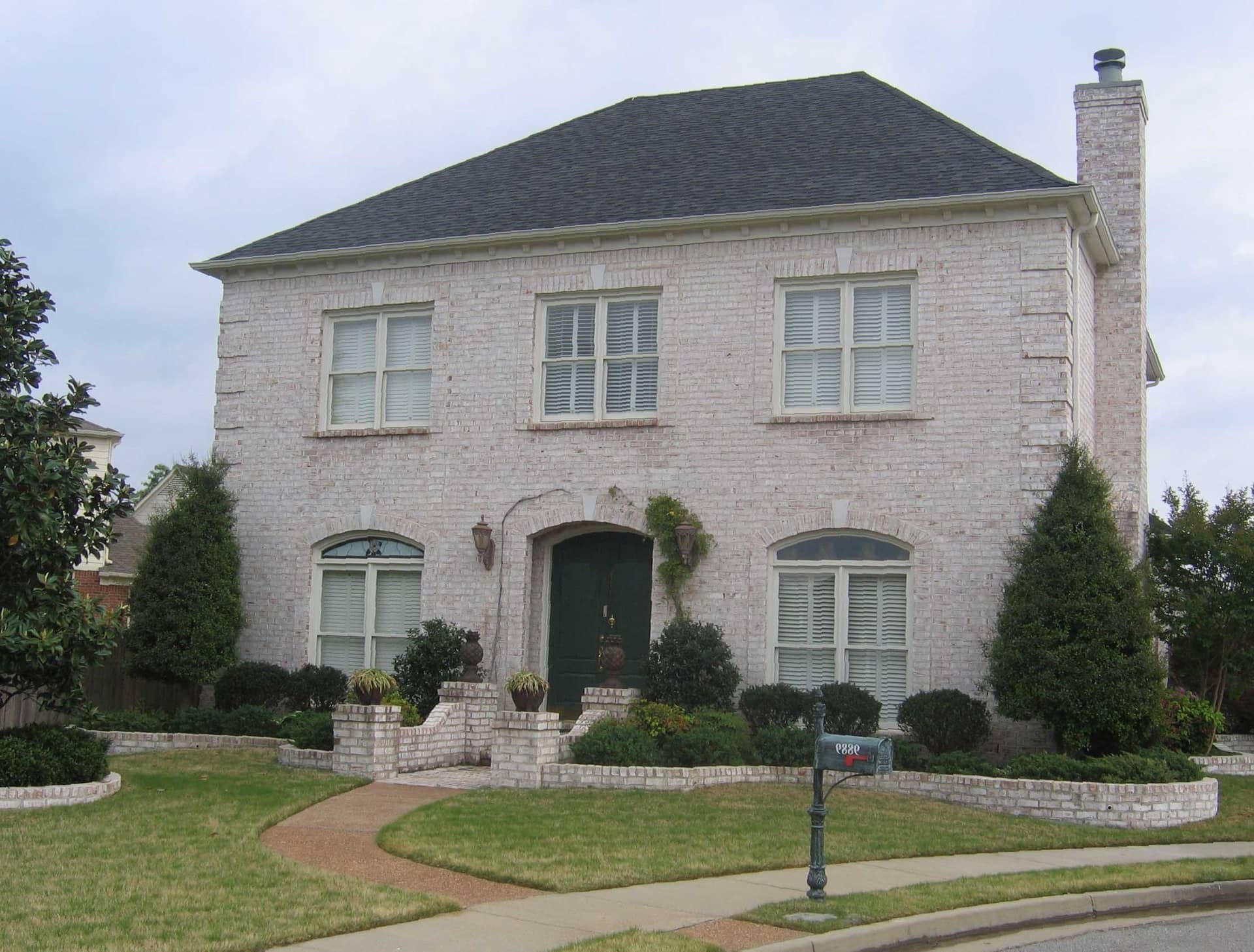 Front view of French home (ThePlanCollection: House Plan #170-1463)