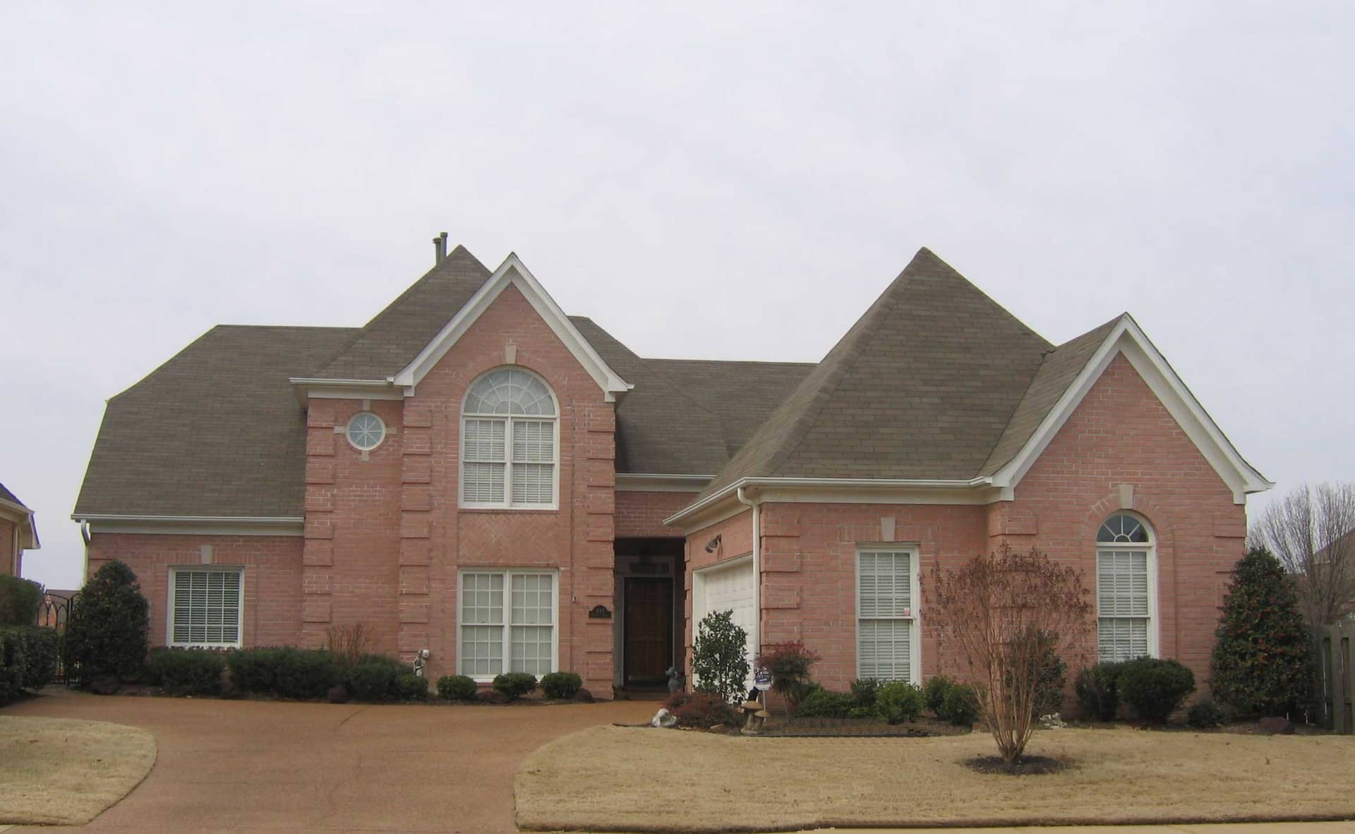 Front view of French home (ThePlanCollection: House Plan #170-1472)