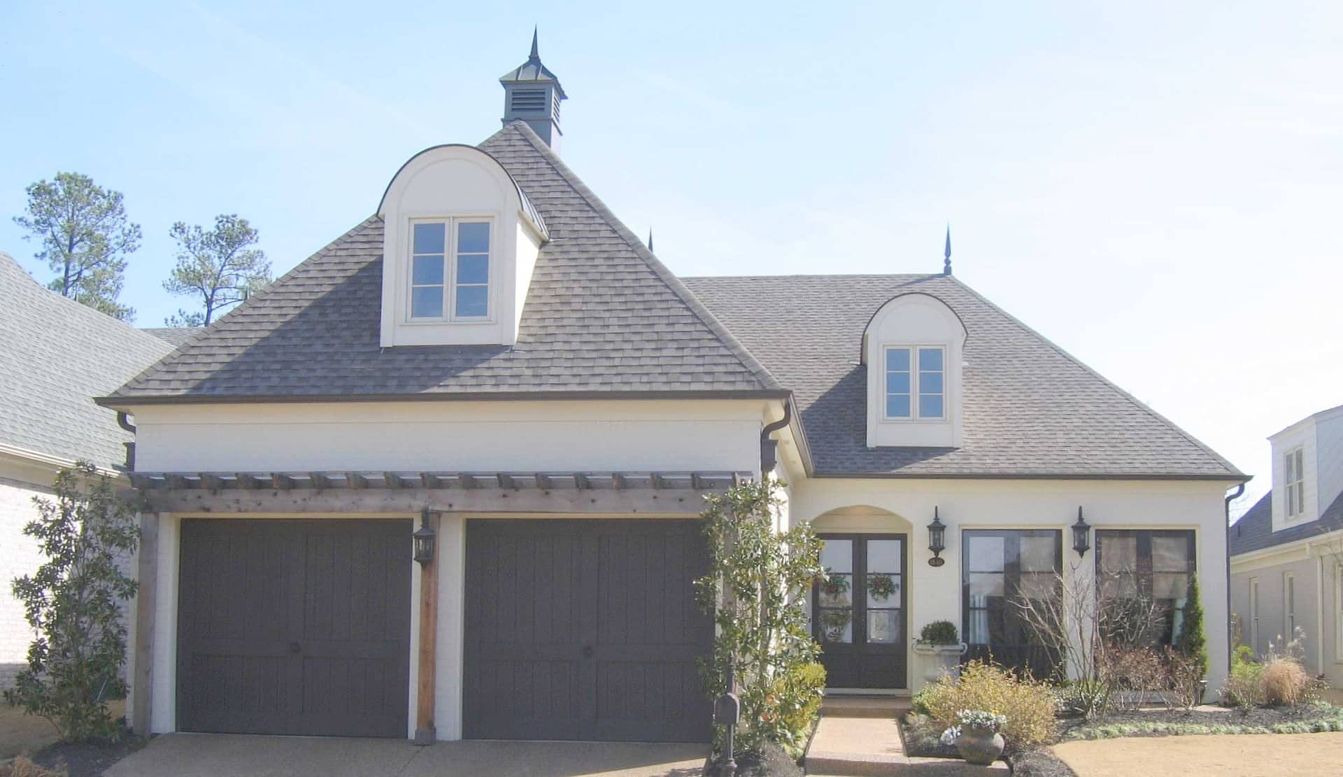 Front view of French home (ThePlanCollection: House Plan #170-1474)