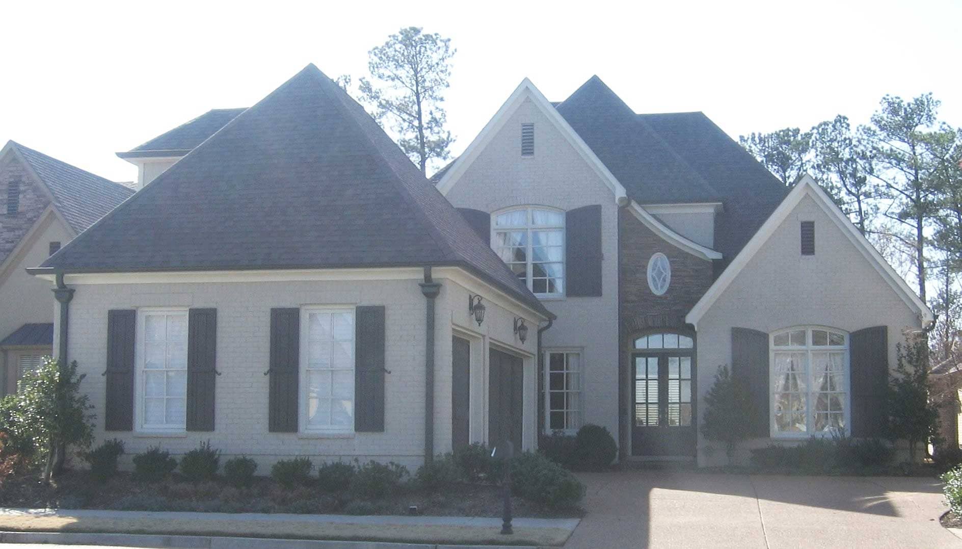 Front view of French home (ThePlanCollection: House Plan #170-1481)