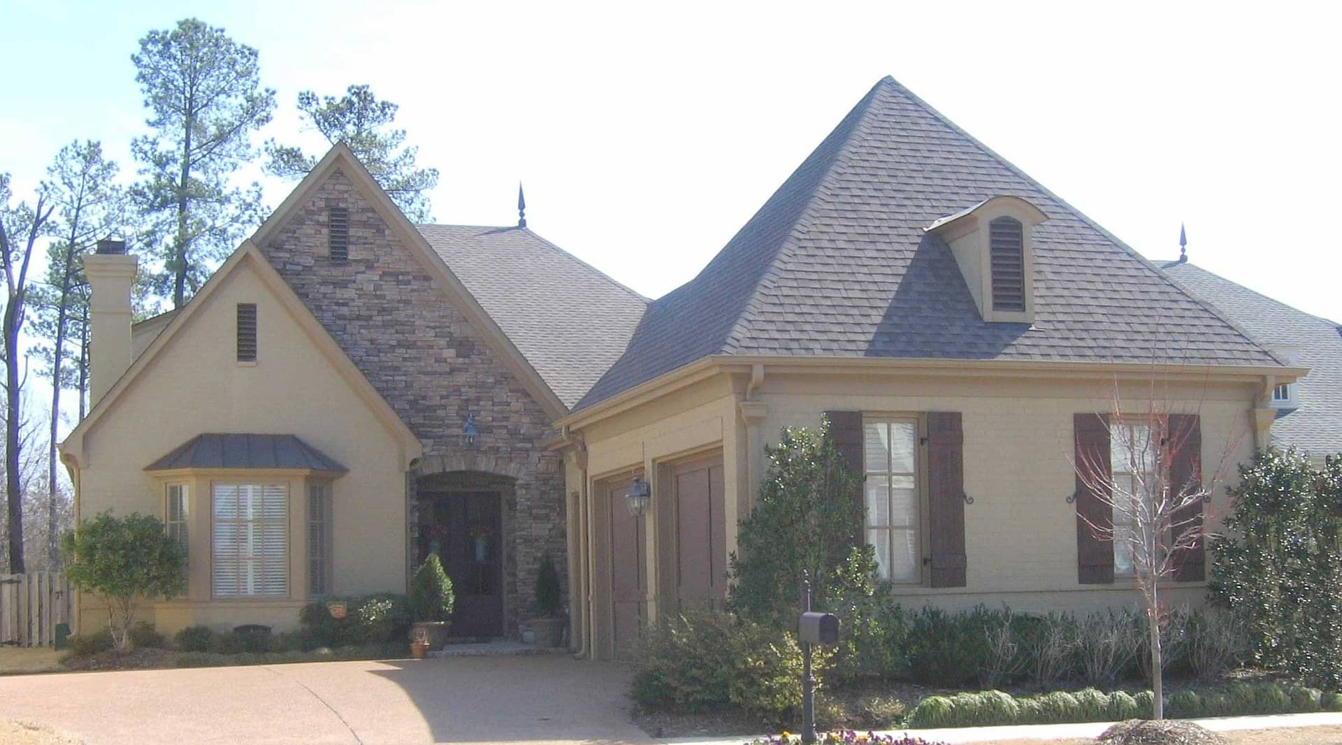 Front view of French home (ThePlanCollection: House Plan #170-1488)