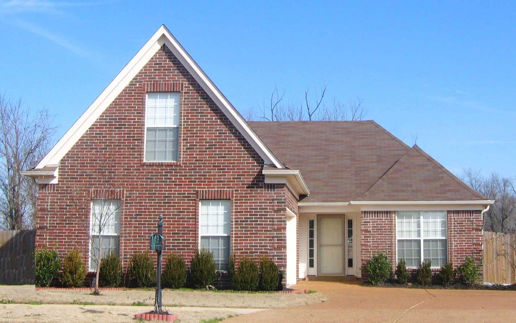 Front view of French home (ThePlanCollection: House Plan #170-1546)
