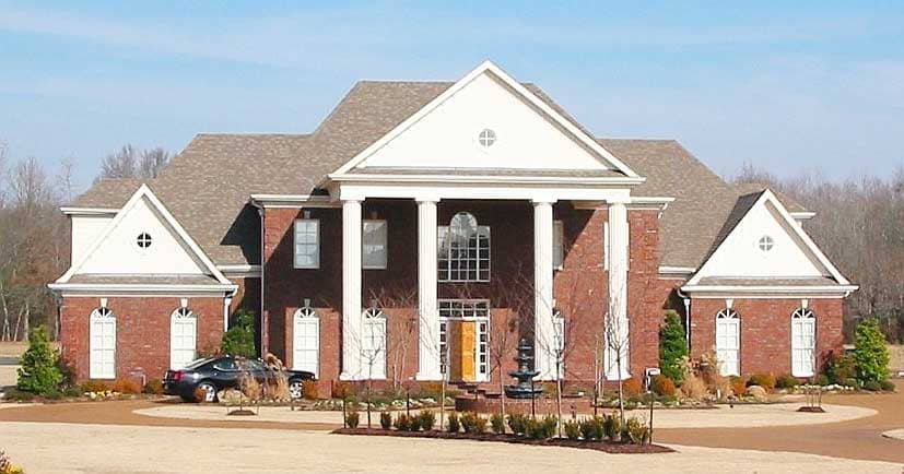 Front view of Luxury home (ThePlanCollection: House Plan #170-1597)