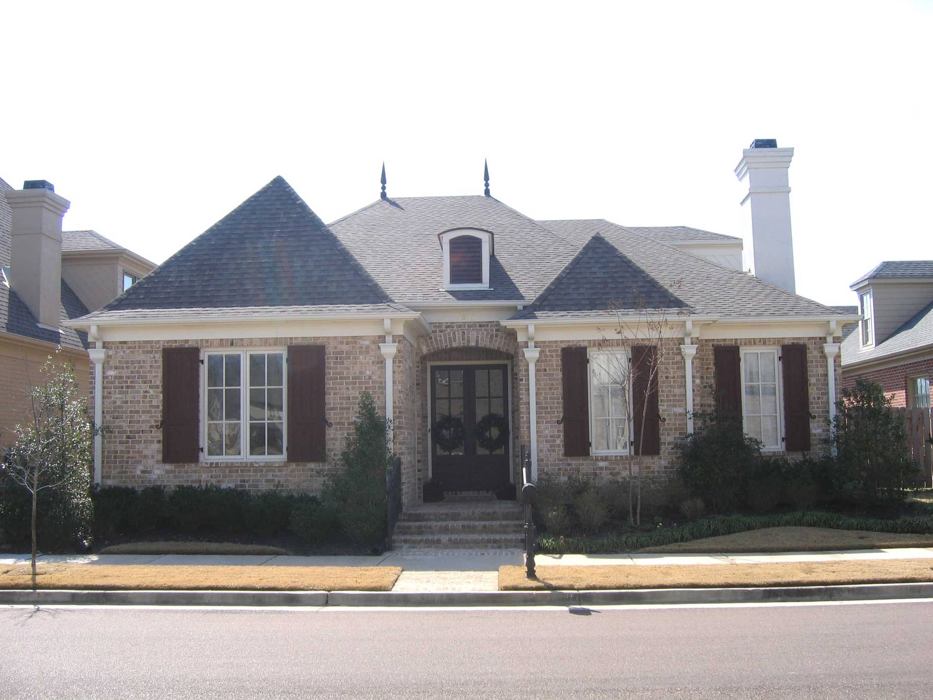 Front view of French home (ThePlanCollection: House Plan #170-1688)