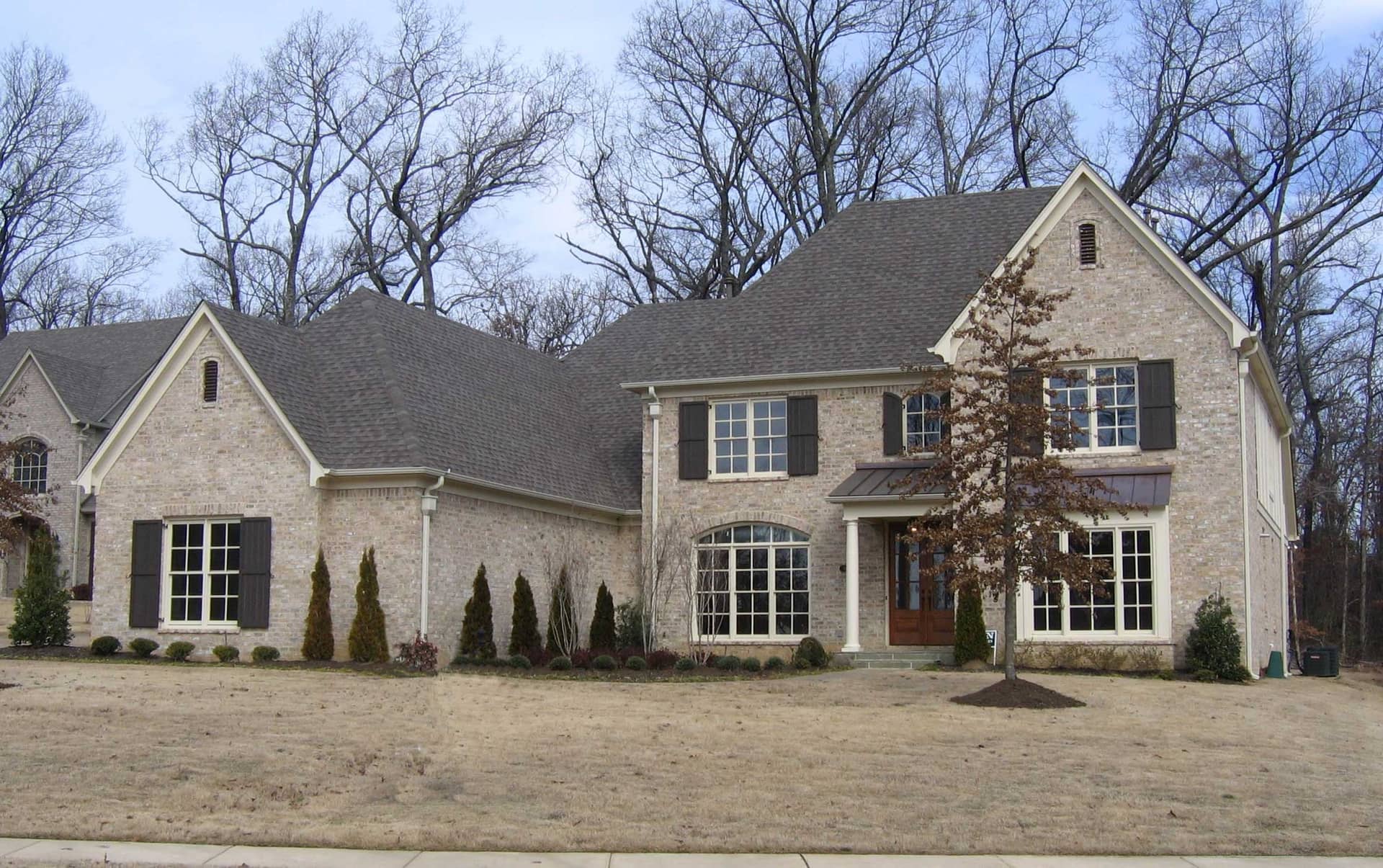 Front view of French home (ThePlanCollection: House Plan #170-1690)
