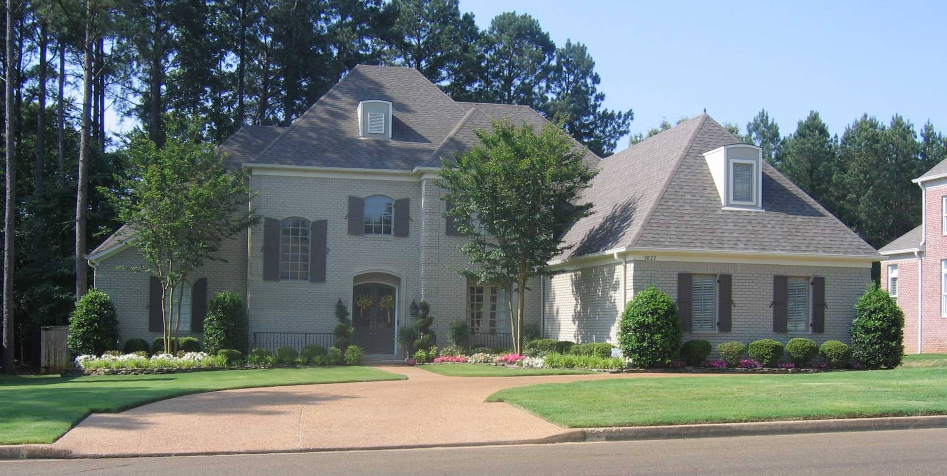 Front view of French home (ThePlanCollection: House Plan #170-1718)