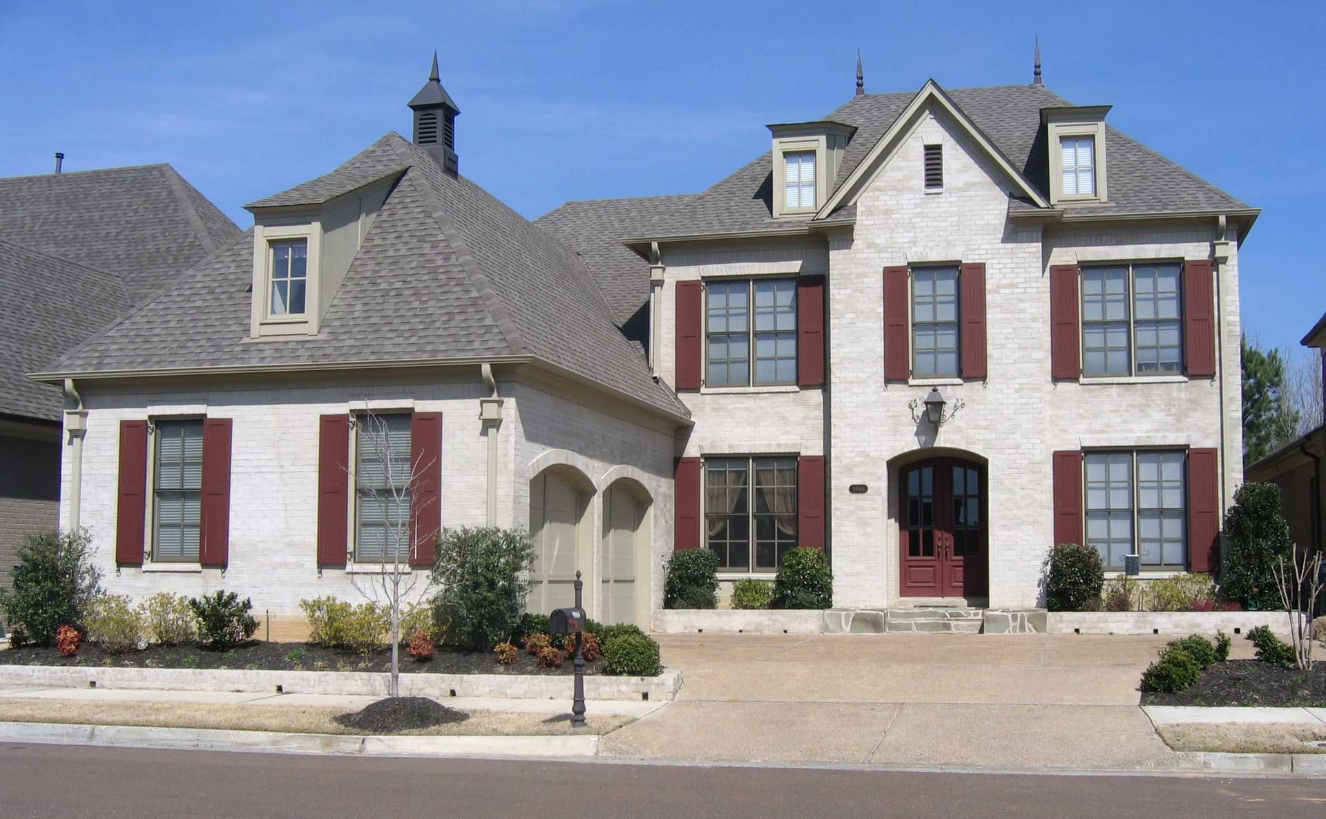 Front view of French home (ThePlanCollection: House Plan #170-1743)