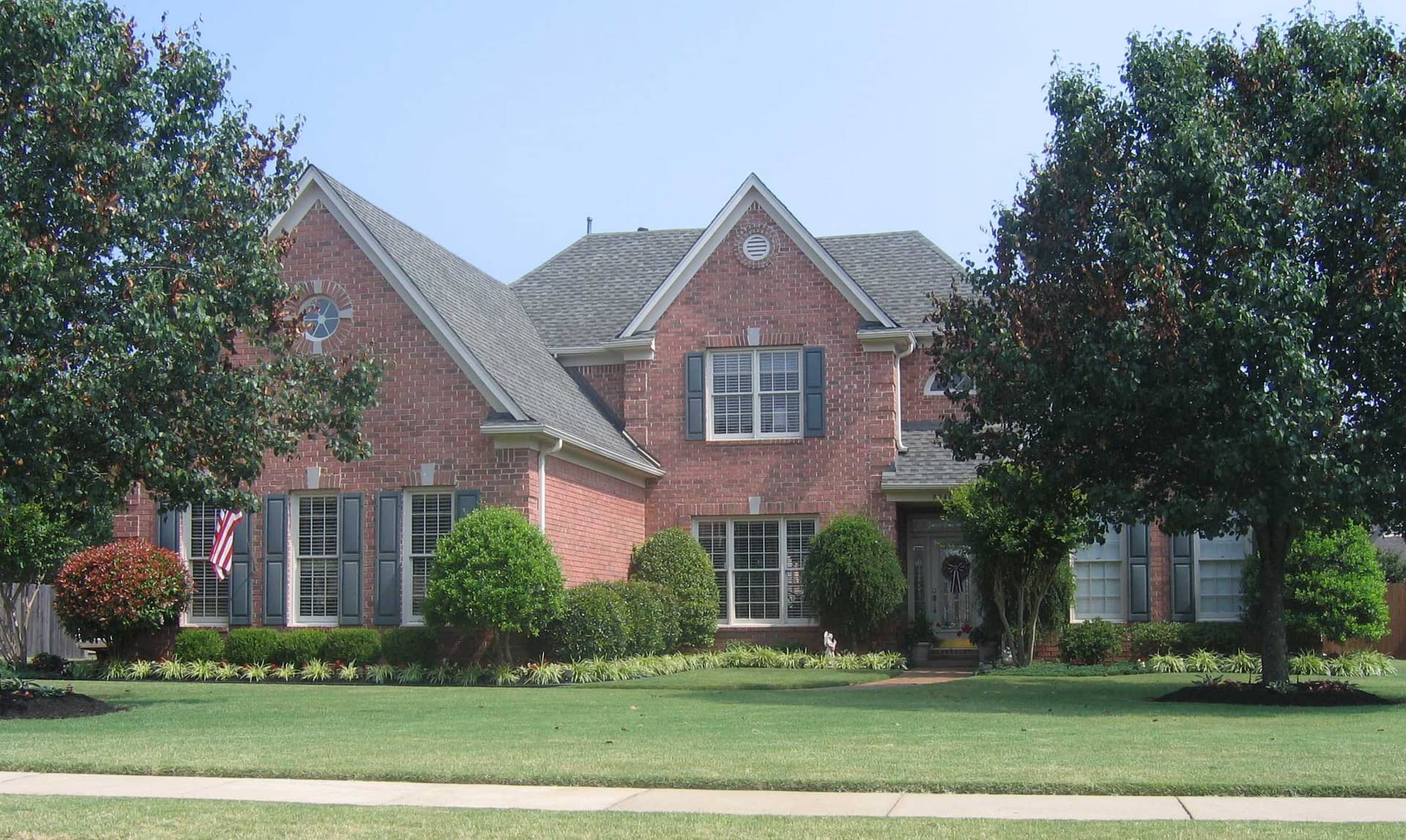 Front view of French home (ThePlanCollection: House Plan #170-1758)