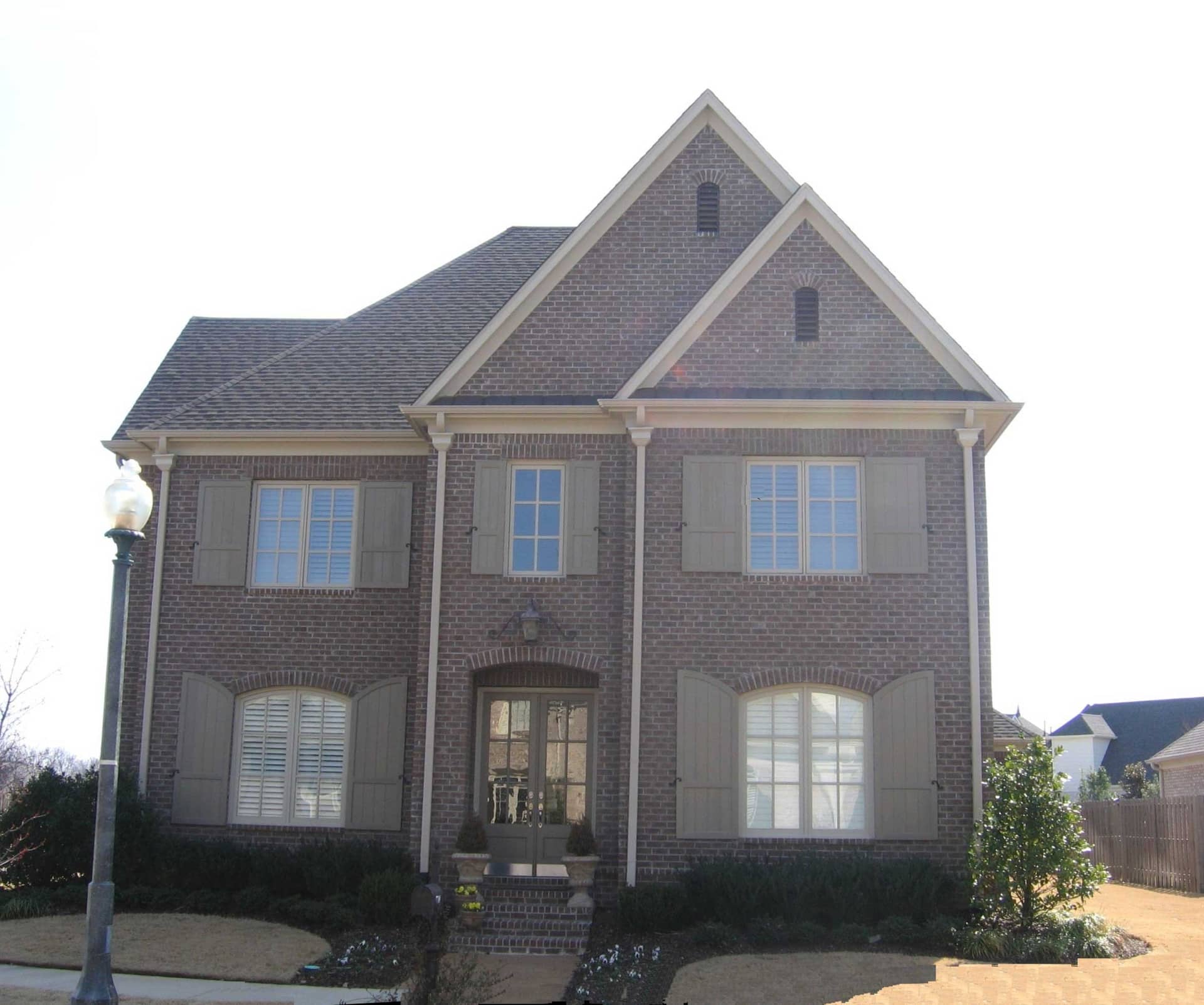 Front view of French home (ThePlanCollection: House Plan #170-1768)