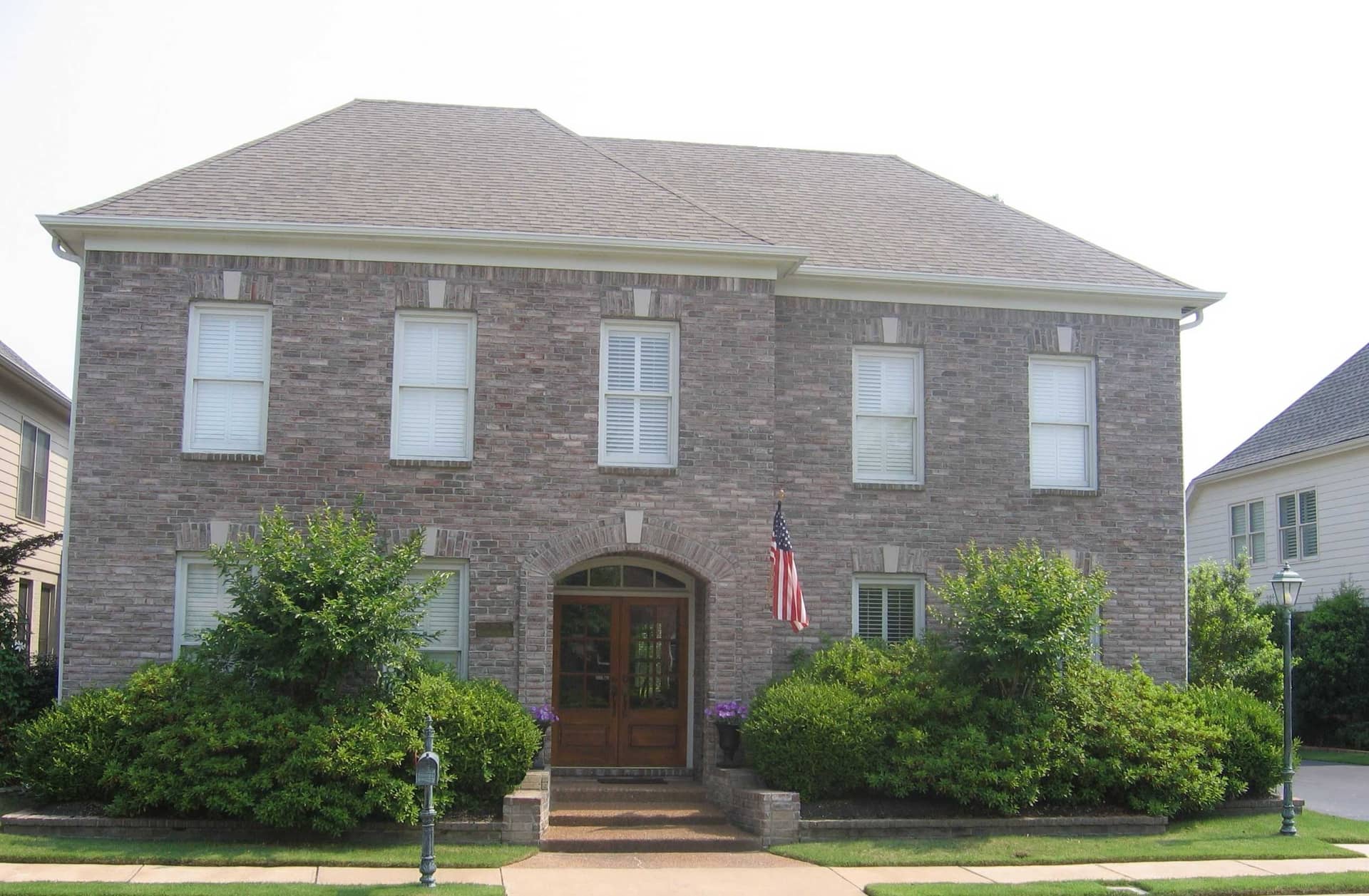 Front view of French home (ThePlanCollection: House Plan #170-1871)