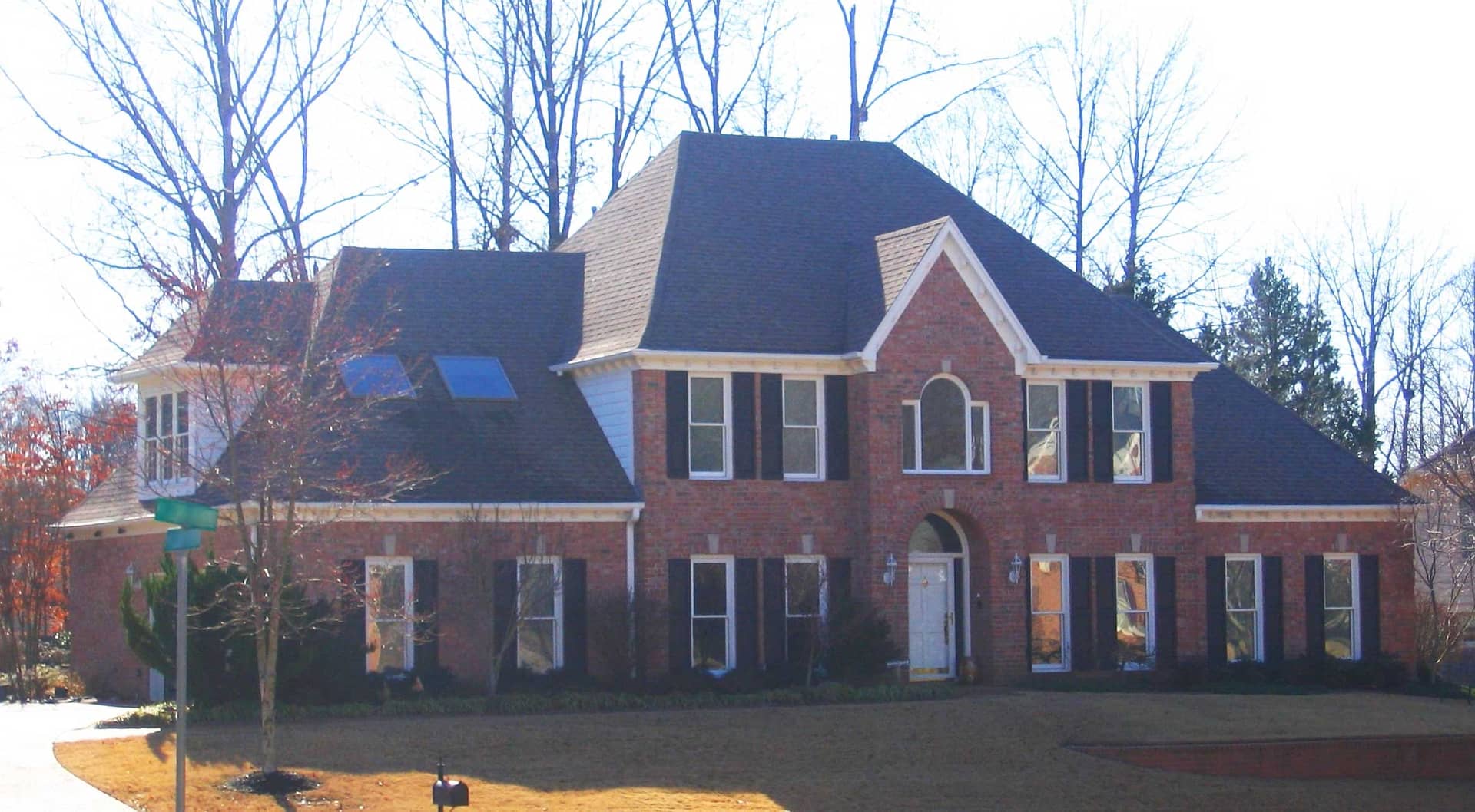 Front view of French home (ThePlanCollection: House Plan #170-1874)