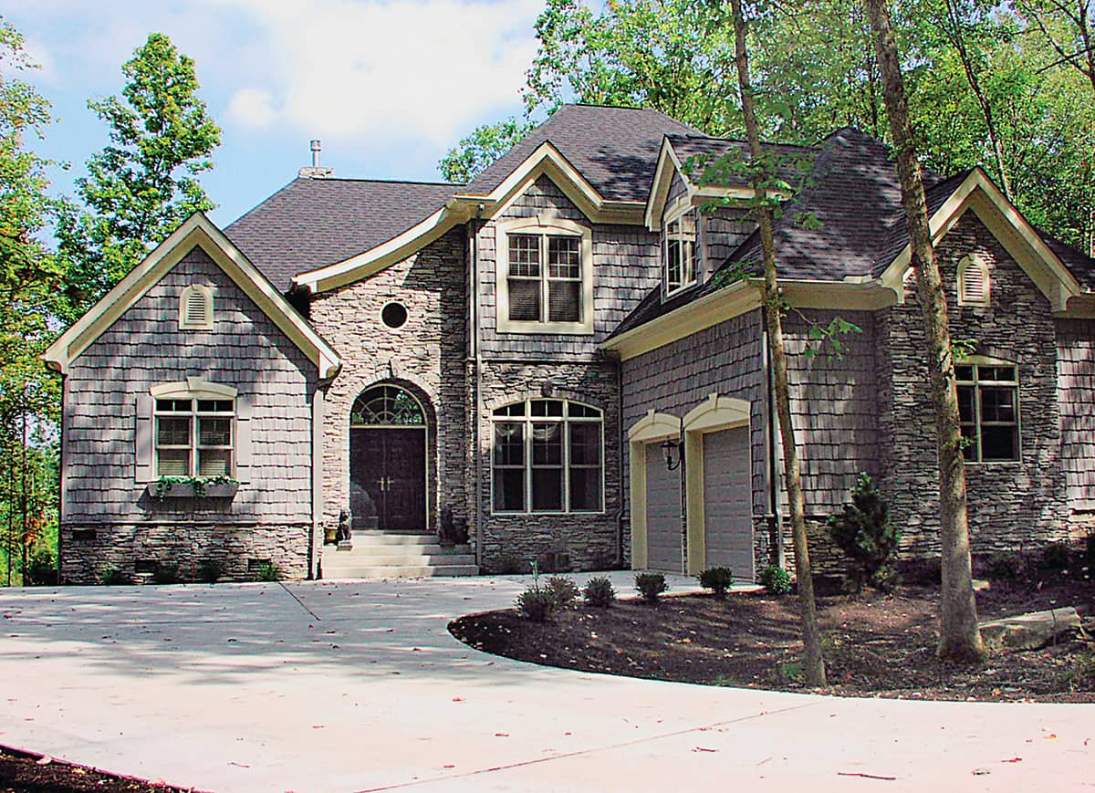 Front elevation of country Craftsman home (ThePlanCollection: House Plan #180-1009)