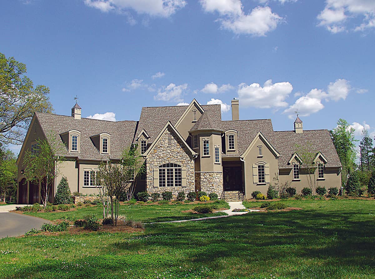 Photo of this French country manor (ThePlanCollection: House Plan #180-1015)