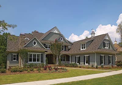 Front elevation of Shingle home (ThePlanCollection: House Plan #180-1028)