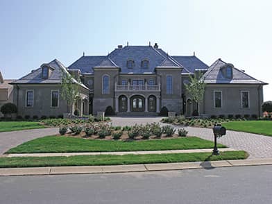 Front elevation of European home (ThePlanCollection: House Plan #180-1033)