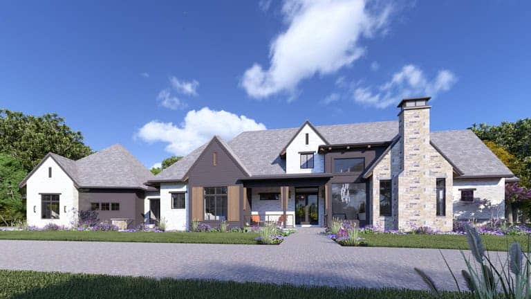 Front elevation of Tudor home (ThePlanCollection: House Plan #194-1082)