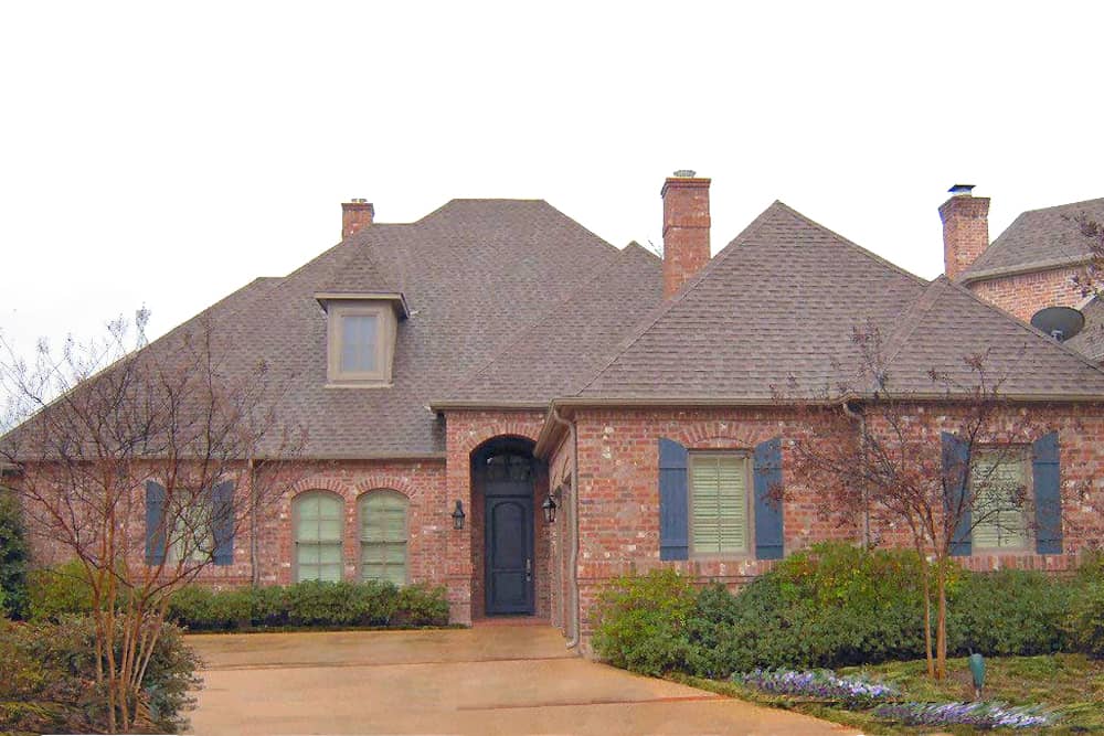 Front elevation of French home (ThePlanCollection: House Plan #195-1188)