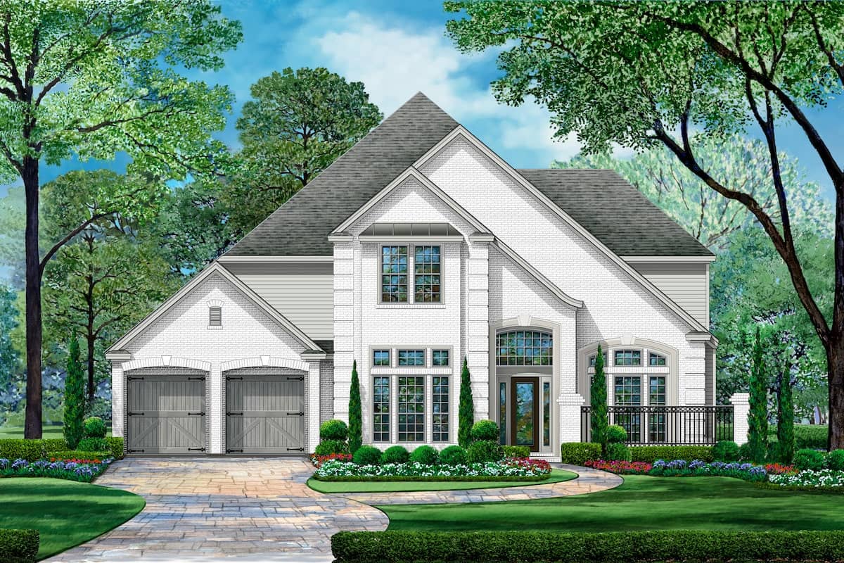 Front elevation of Tudor home (ThePlanCollection: House Plan #195-1199)