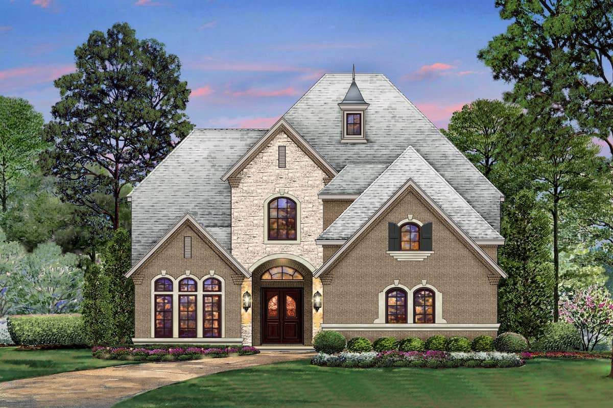 Front elevation of Tudor home (ThePlanCollection: House Plan #195-1204)