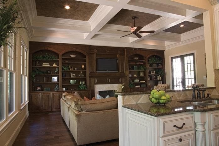 A coffered ceiling with intersecting beams creates recessed panels.