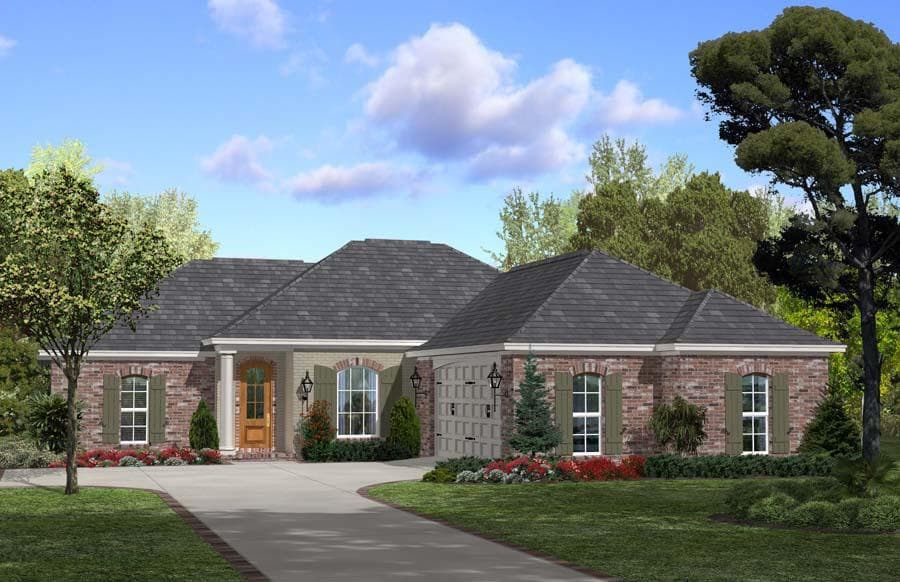 A low hip roof slopes toward all four sides of this ranch home.