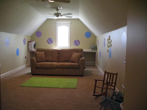 A knee wall closes off the low space where the sloped roof meets the upper floor.